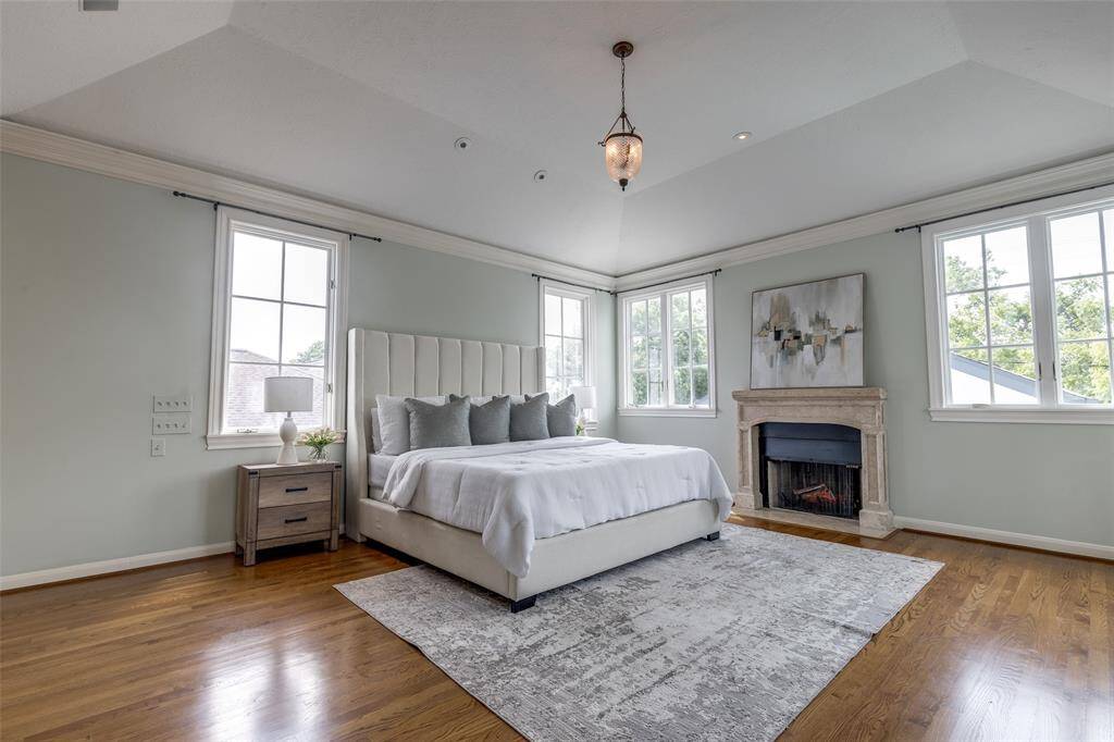 Master bedroom with vaulted ceilings and abundant natural light.