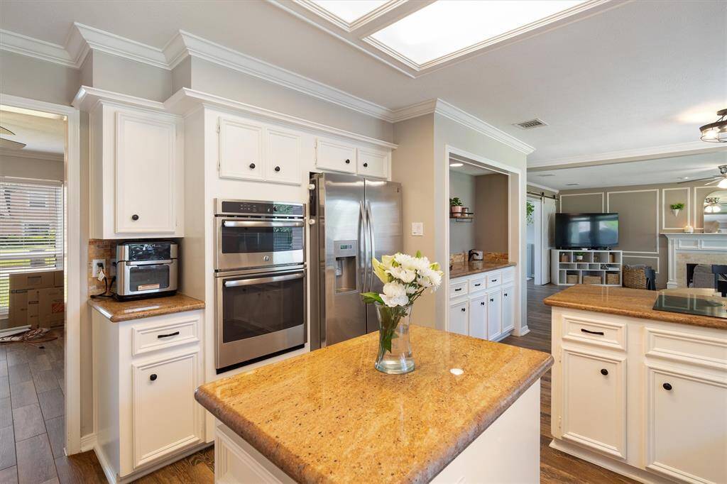 Stainless steel appliances and granite countertops.