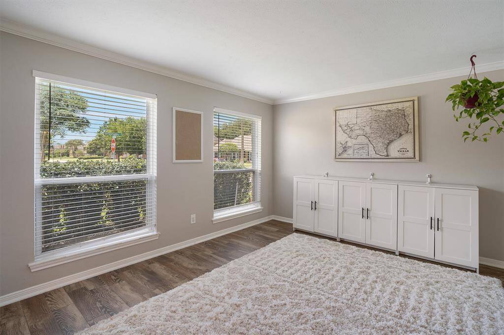 Study/game room immediately upon entry. Accented with crown molding and fresh paint, huge windows letting in a ton of natural light.