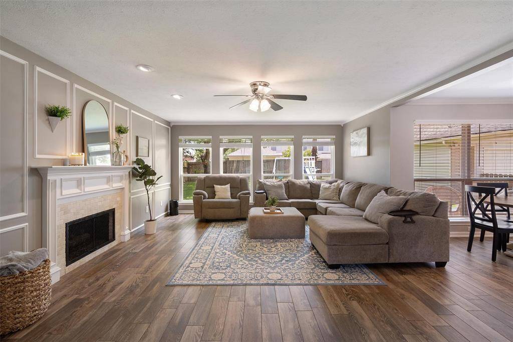 Accent wall in the grand living room, wall of windows overlooking your backyard