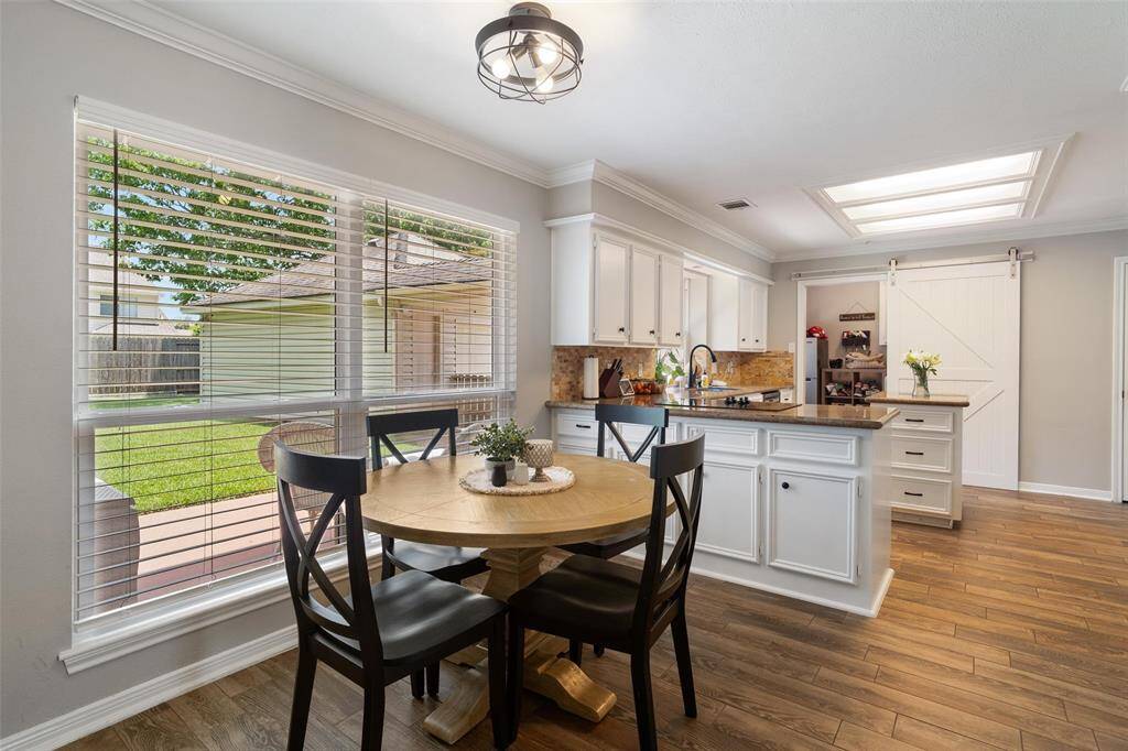 Breakfast area right off the kitchen, Texas sized window where you can overlook your beautiful back yard