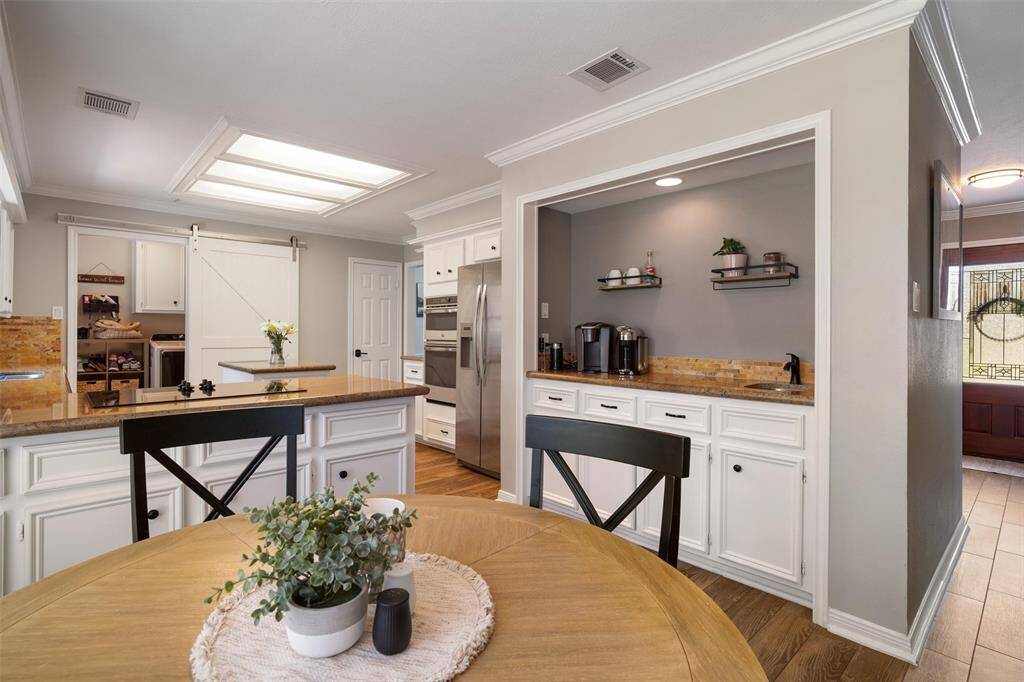 Breakfast area right off the kitchen. Wet bar offers additional storage and counter space, as well as an extra sink