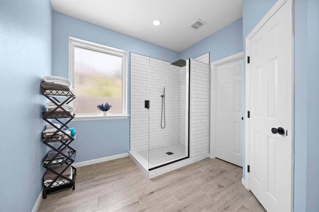 Recently remodeled en-suite with large walk in shower, and closet