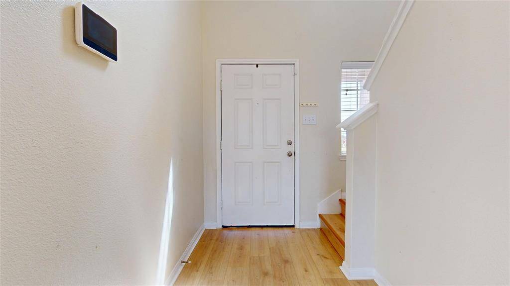 2429 Regatta Ln, Entrance hallway with stairs to the 2nd floor, new wooden laminate flooring throughout the entire house.