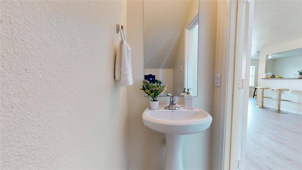 2429 Regatta Ln, 1/2 bathroom with a white pedestal sink.