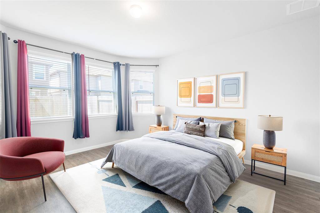 Digitally Staged! Spacious primary suite or can be use as a guest suite, with layout flexibility and great potential—imagine it transformed with updated lighting and personal touches.