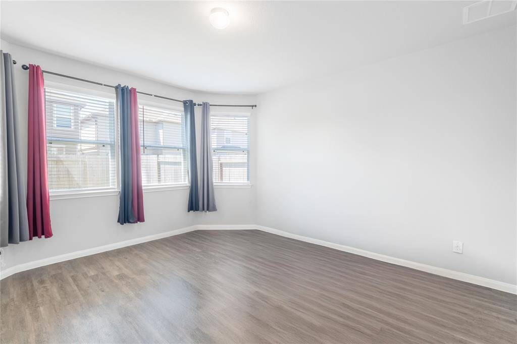 Actual furniture digitally removed to show potential. Flexible suite layout—ideal as a primary or guest room.