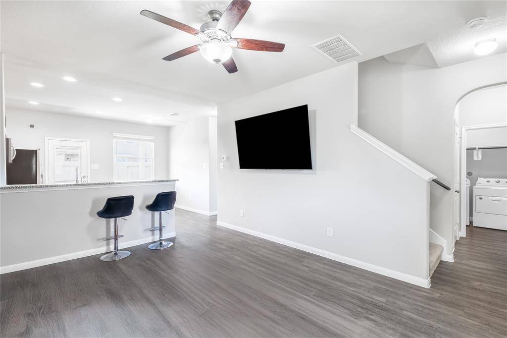 Living Room, imagine it transformed with updated lighting and personal touches.