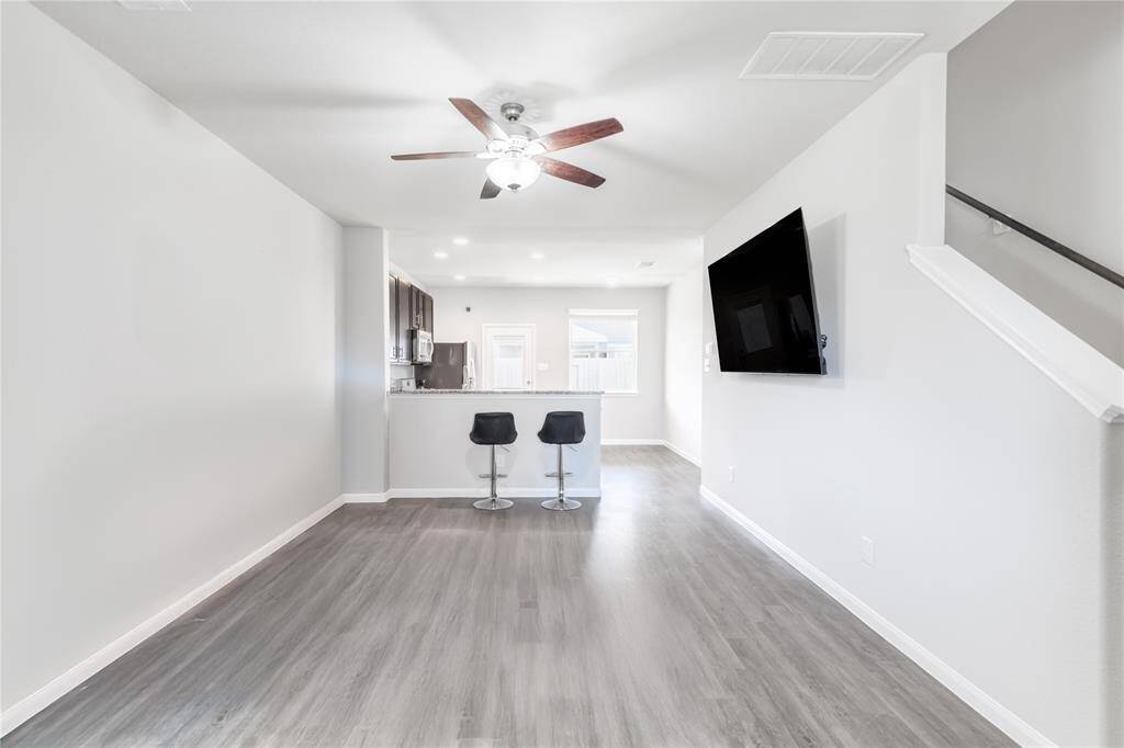 Living Room, imagine it transformed with updated lighting and personal touches.