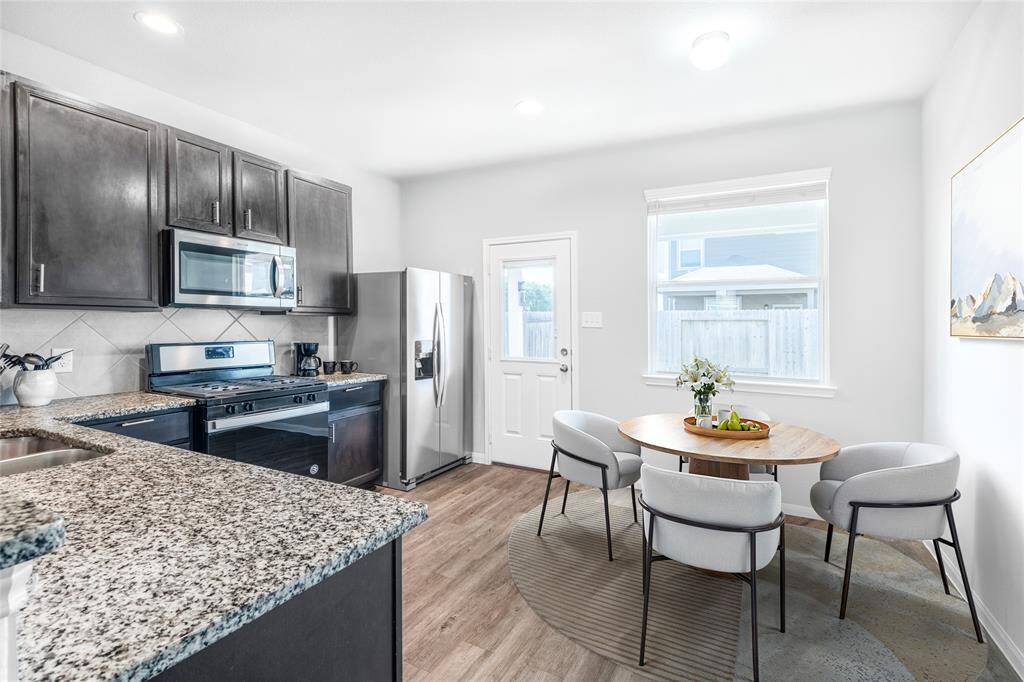 This digitally staged dining area highlights the room’s full potential, showcasing how it can become a bright and welcoming space