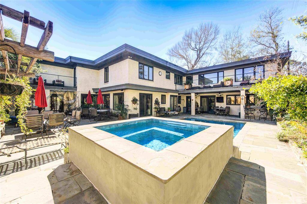 Large, mid-century modern home updated with oversized backyard, pool+spa & summer kitchen perfect for outdoor entertaining.