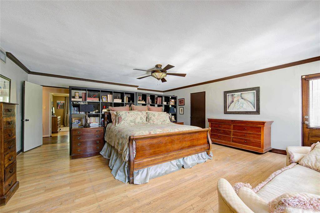 Spacious primary bedroom with sitting area and cedar closet, has east sun for the early riser and access to two balconies for additional spaces to relax.