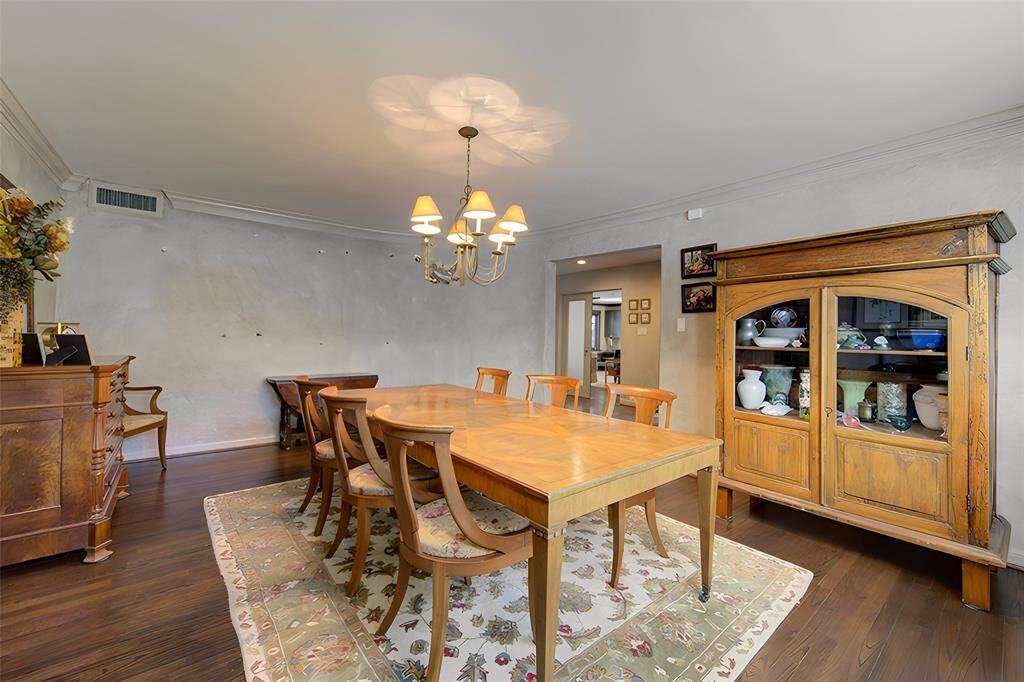 Dining room, measures 18 x 13, has lovely west light and original plaster wall detail from 1956.