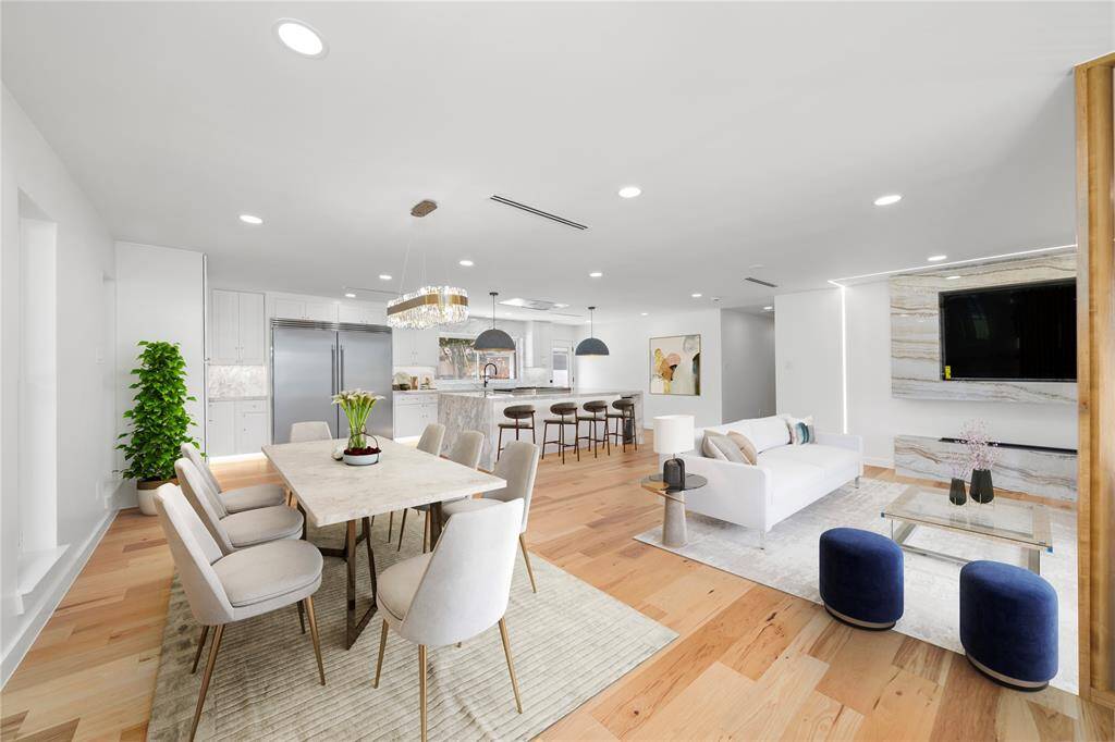 Expansive Open-Concept Living – The seamless flow between the gourmet kitchen, sophisticated dining space, and inviting living room creates a perfect setting for both entertaining and everyday luxury.