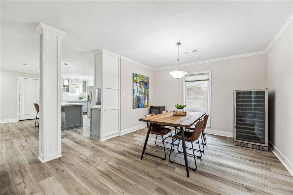 Spacious dining area seamlessly connects with the kitchen and living room, ideal for entertaining.