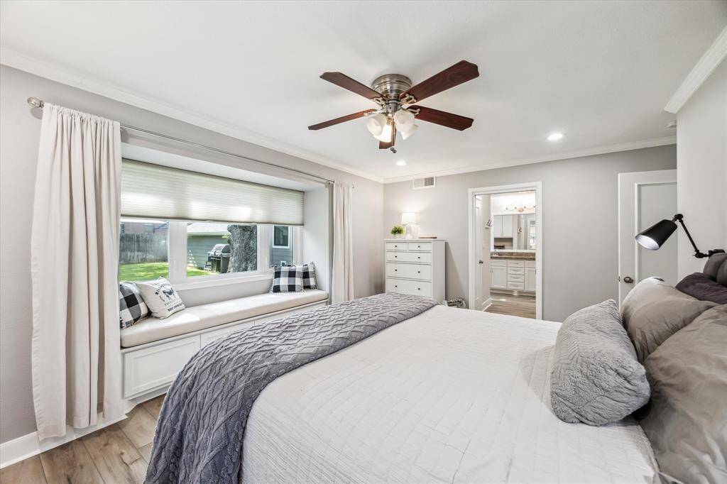 Experience the perfect blend of comfort and style in the primary bedroom, featuring recessed lighting, a ceiling fan, and a cozy window seat overlooking the backyard.