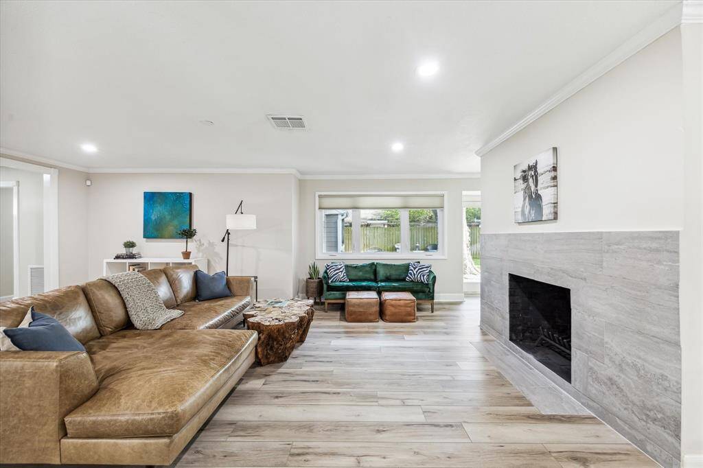 Abundant natural light pours through double-paned windows, offering stunning backyard views.