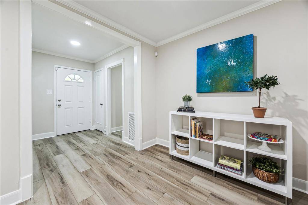 An inviting entryway seamlessly opens into a spacious  and open living area.