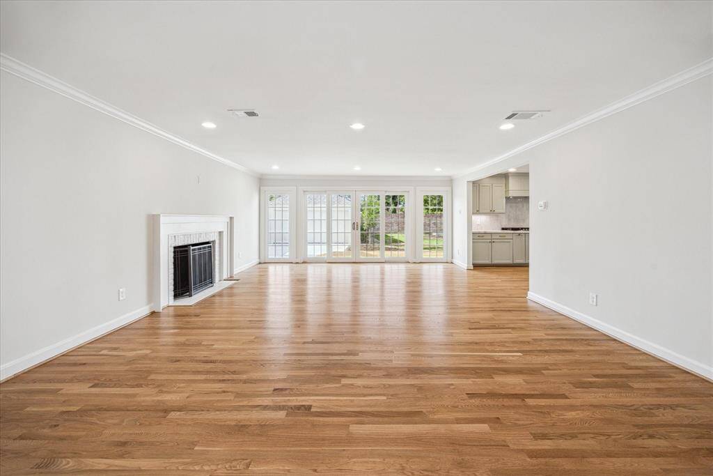 Living room with access to the back porch.