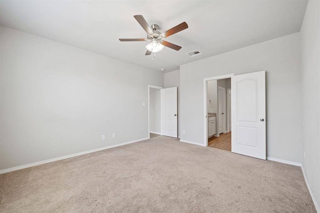 A different angle of primary bedroom