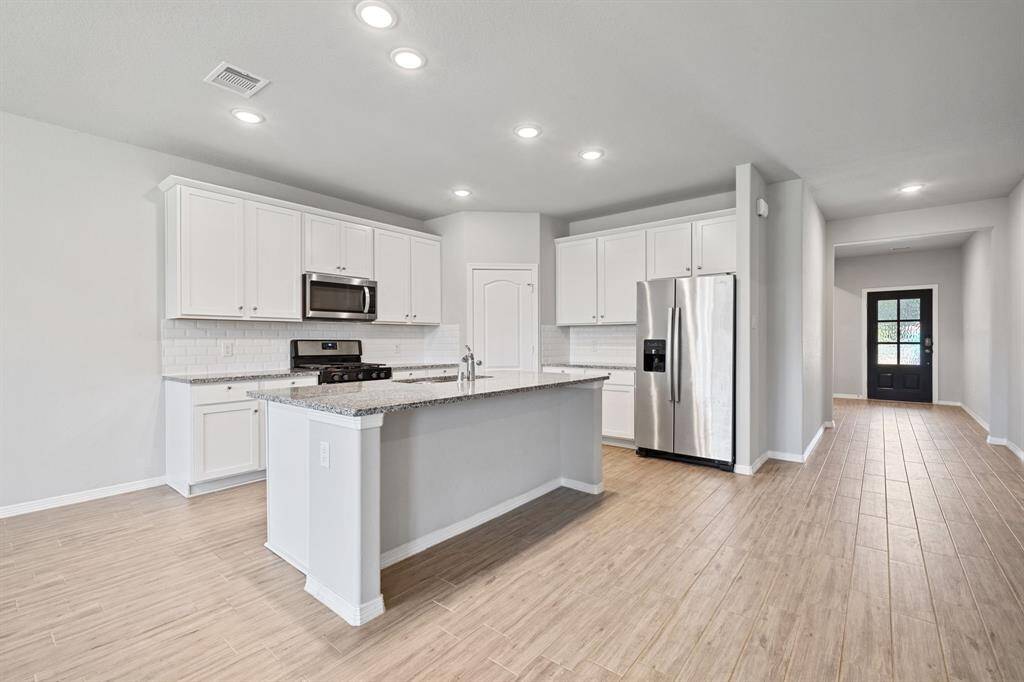 Open Kitchen with plenty of storage and walk in pantry