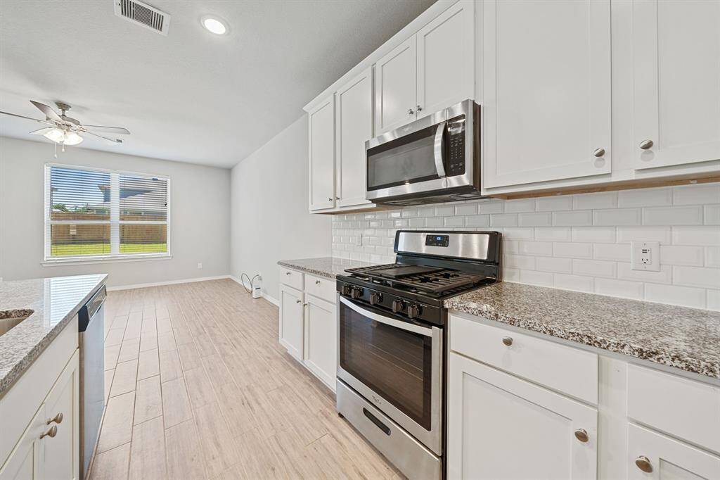 Kitchen opens up to breakfast area