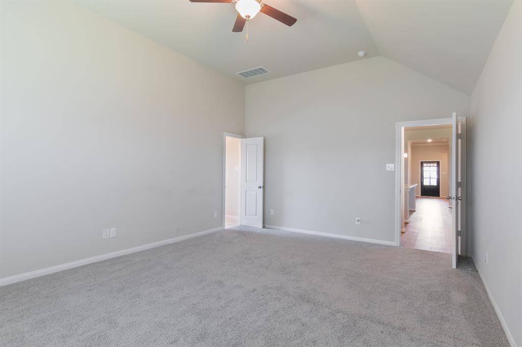The spacious primary suite is light and bright.