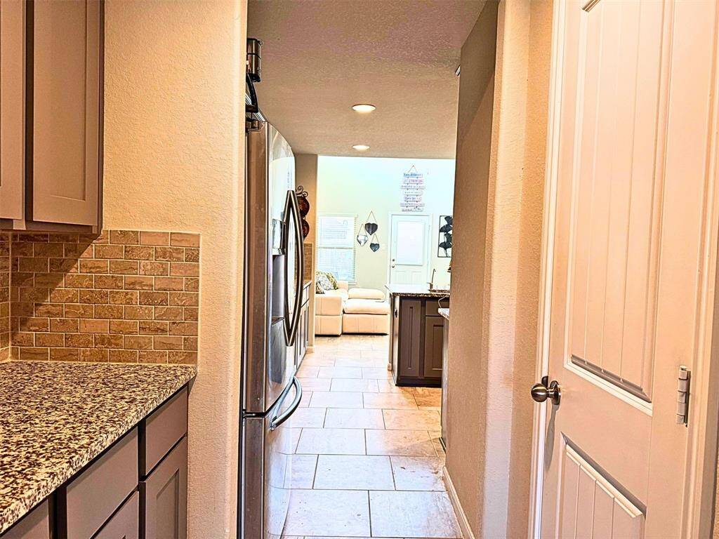 Butler Pantry leading from dining room into kitchen