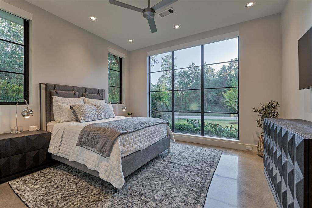 Comfortable guest room on the main floor with nearby full bath and custom finishes