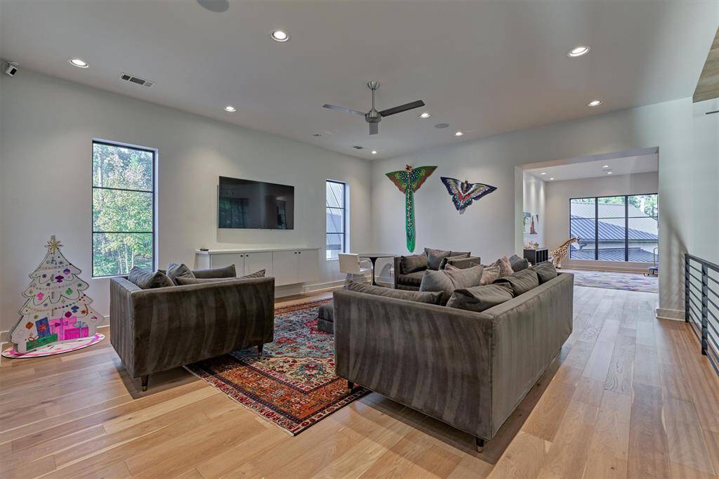 Versatile upstairs landing space perfect for lounging, studying, or gaming
