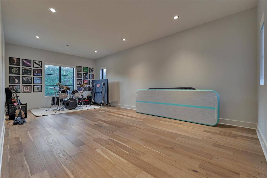 Flexible room currently used as a music space, with plumbing for potential mother-in-law suite conversion