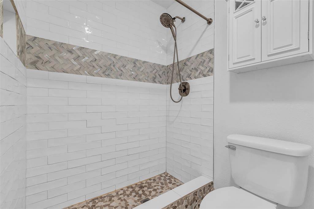 Large custom shower in second bath.