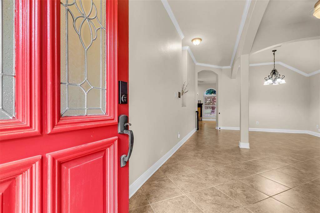 Step inside and be greeted by high ceilings, custom crown molding and open living.