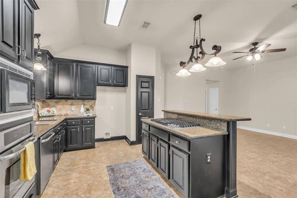 Granite counters and an abundance of cabinet storage.