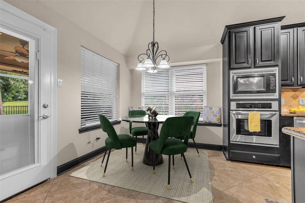 Breakfast room adjacent to the kitchen.  Cozy window seat and views of the backyard.