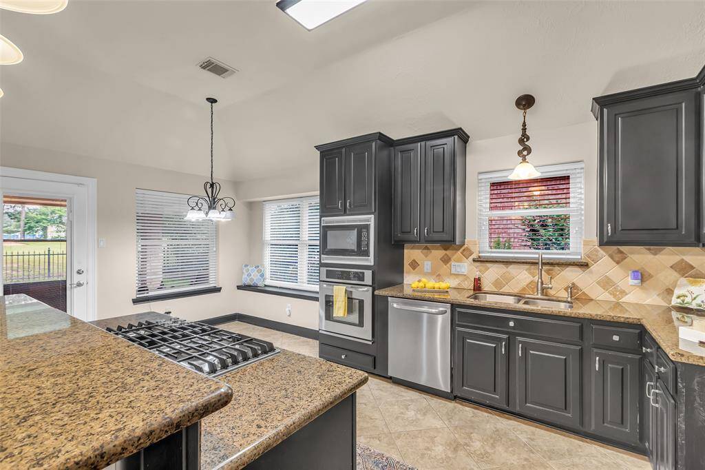So much counter space along with stainless appliances.