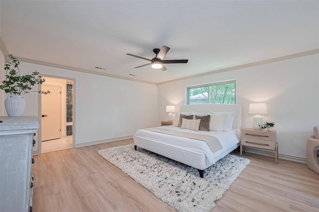 Now this is a Primary bedroom. Tastefully designed for tranquil night's sleep, lovely sitting area makes for a serene atmosphere. This primary is sure to accommodate even the largest bedroom furniture.