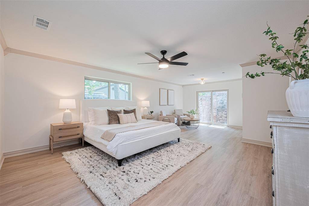 Massive primary bedroom w/cozy sitting area off of atrium & 3 walk-in closets.