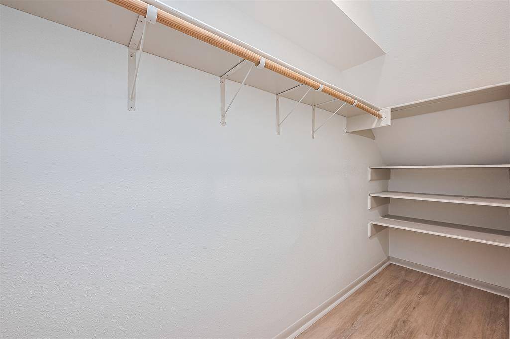 3rd Primary walk-in closet with shelving can be used for a linen closet and storage as well.