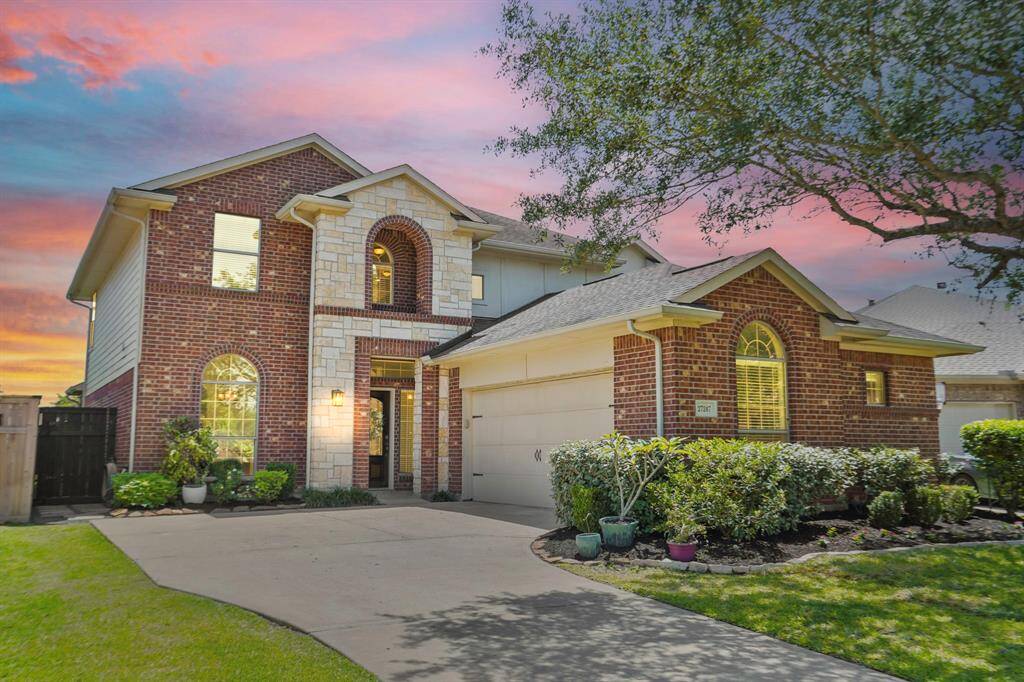Welcome home! This spacious 2 story home welcomes you with a warm brick and stone exterior. It features lush landscaping and sensational curb appeal!