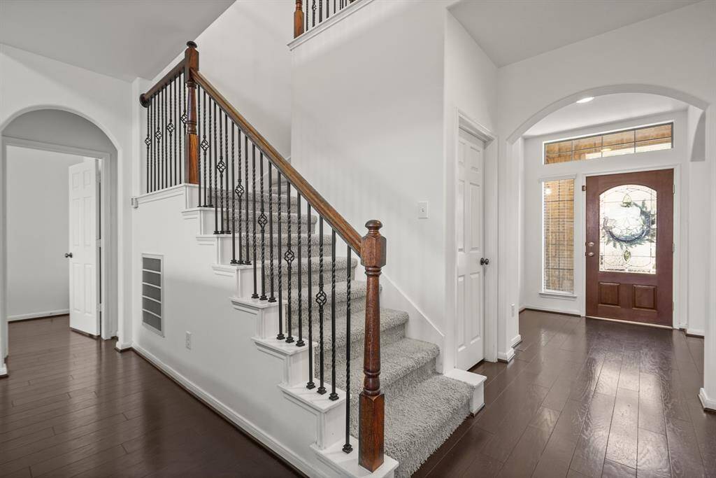 Heading upstairs, you see another view of the open entry way! Upstairs you will find a game room, media room, and 2 secondary bedrooms!
