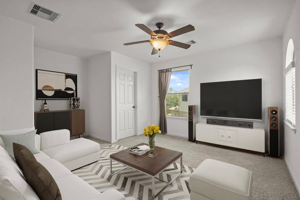 Grab the popcorn, put on a movie, and enjoy a wonderful evening in your amazing media room! Featuring plush carpet, fresh paint, and a ceiling fan which makes this the perfect room for relaxing!  *This room has been virtually staged