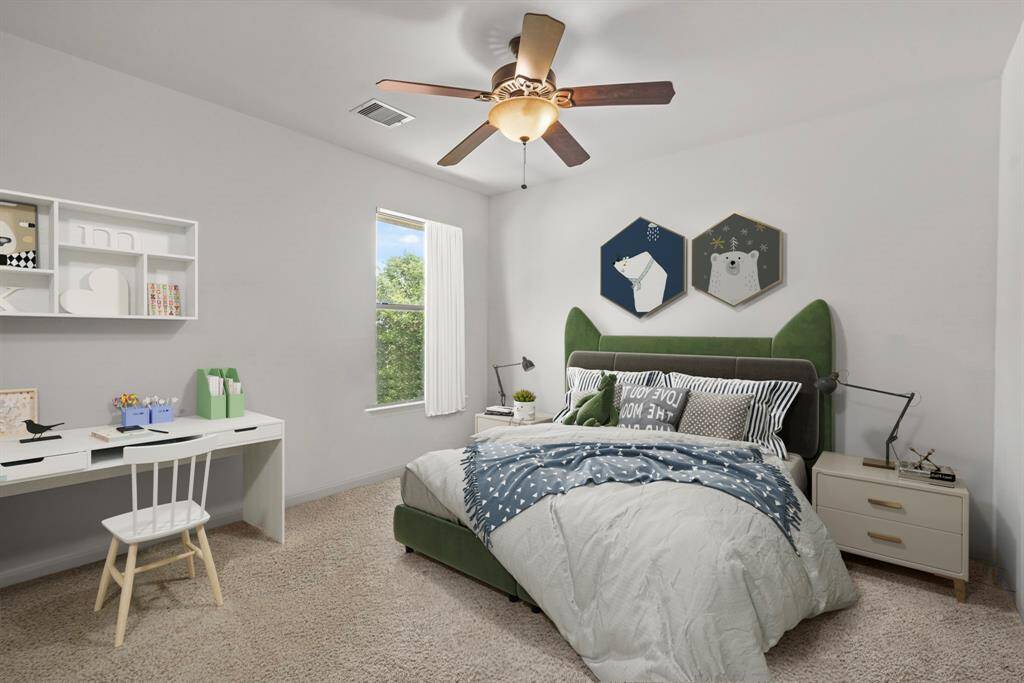 This spacious secondary bedroom features bright natural light, a ceiling fan, spacious closet, and plush carpet! *This room has been virtually staged
