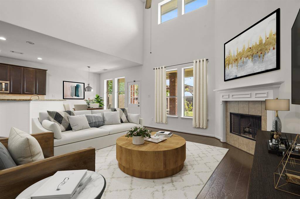 Gather the family and guests together in your huge living room! Featuring high ceilings, a ceiling fan, wood floors, and large windows that provide plenty of natural lighting throughout the day! *This room has been virtually staged