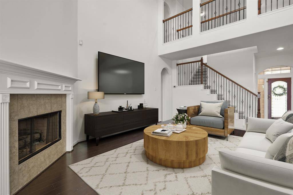 Imagine hosting the next holiday or social event in the perfect living space! You'll love cozying up by the fireplace, complete with a painted wood mantle and tile surround. This room can fit any size tv making it great for the next big game or movie night. *This room has been virtually staged