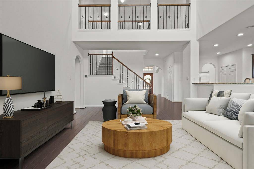 Bright, airy, and inviting, the heart of the home is its open-concept kitchen and living area, ideal for entertaining or relaxing with family.  *This photo has been virtually staged