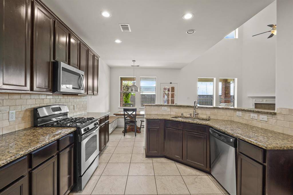 This kitchen will not disappoint! There is plenty of storage and counterspace making this kitchen every chef's dream! It opens to the family room and breakfast nook making it perfect to host any event or holiday!