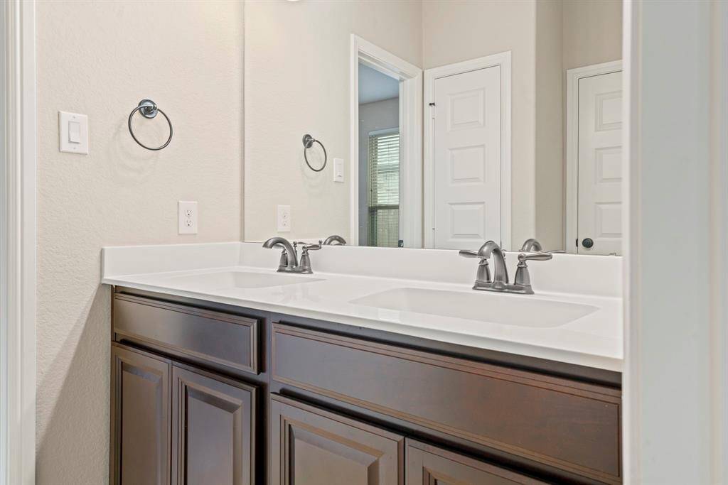Spacious Jack and Jill bathroom with elegant double vanity.