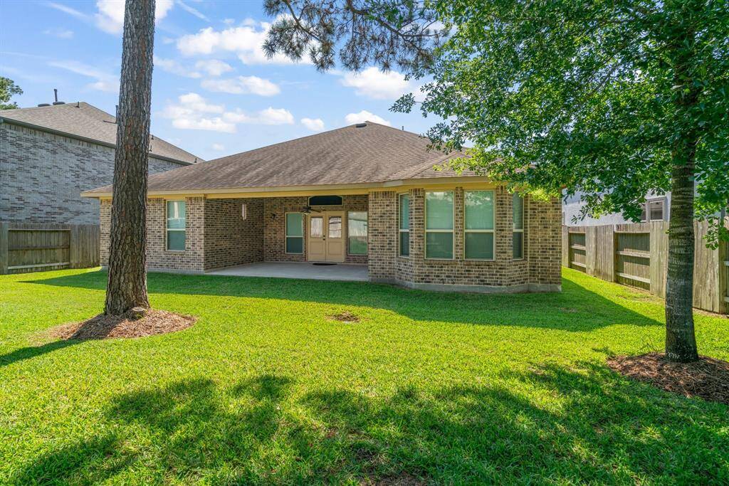 Great big covered patio with spacious yard