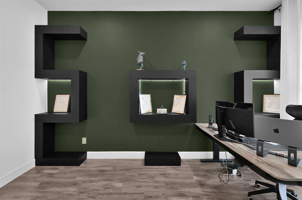Custom built-in shelves and accent wall.